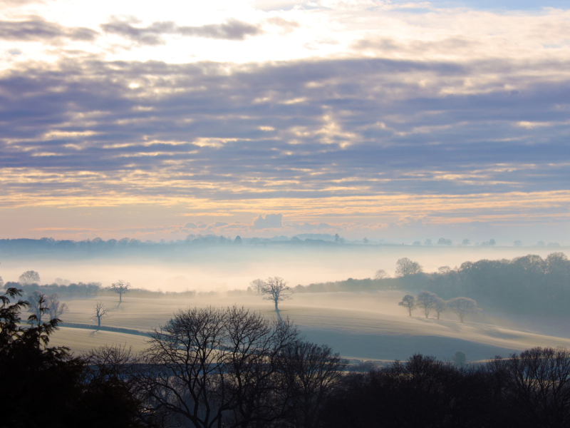 Landscape view across farmland to Munderfield from Bromyard Downs, Herefordshire. 